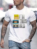 Person wearing a white t-shirt with a graphic design and text, walking outdoors.